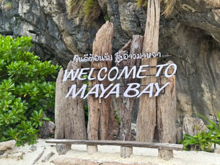Wooden Maya Bay sign at the entrance of the beach inside the national park