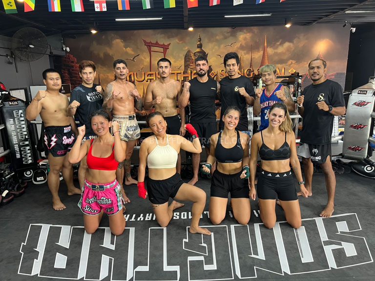 Group of Muay Thai students posing together after a training session in Koh Phi Phi