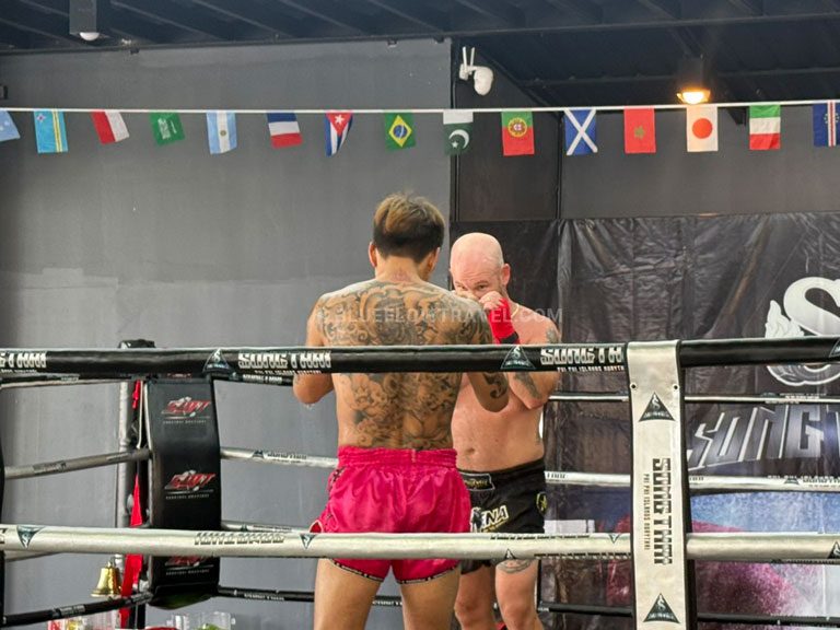 Muay Thai students training together inside a boxing ring in Koh Phi Phi